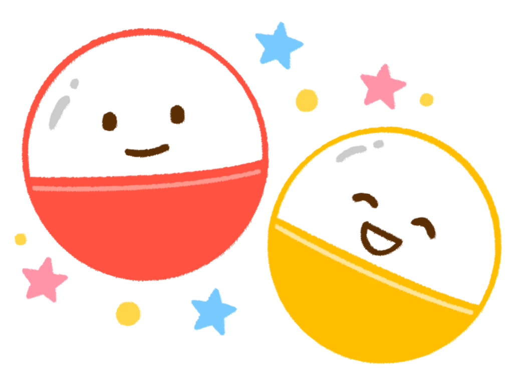 赤と黄色のにっこりした笑顔の空カプセル